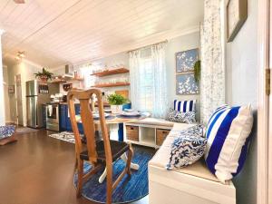 a kitchen with a table and a chair in a room at SLEEPS SIX - Rent Entire WATERFRONT Cabin #2 in Etoile