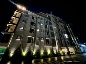 a large building at night with lights on it at HOTEL ROYAL VANILLA in Siliguri