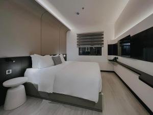 Postel nebo postele na pokoji v ubytování The Concept Hotel HCMC- District 1