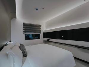 Postel nebo postele na pokoji v ubytování The Concept Hotel HCMC- District 1