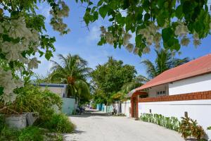 a street in front of a building at Thulusdhoo Inn in Thulusdhoo