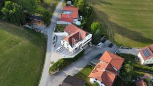 an overhead view of a large house with a yard at Villa Theresa in Hofstetten