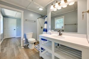 a bathroom with a sink and a toilet at Chippewa Falls Getaway with Community Lake Access! in Chippewa Falls +19 photos