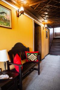a room with a bench with two pillows on it at Къща ЕТНО in Koprivshtitsa