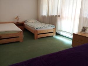Posteľ alebo postele v izbe v ubytovaní Apart