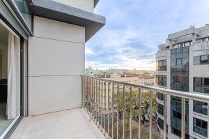 a balcony with a view of a city at Olissippo Saldanha in Lisbon