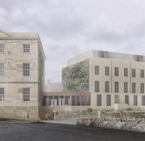 an external view of a building with a green facade at Bailiffgate Hotel in Alnwick