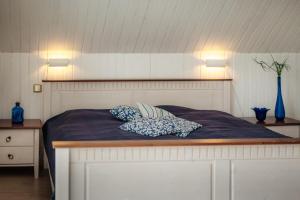 a bedroom with a bed with two pillows on it at Feriendomizil Tippe in Braunlage
