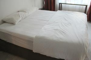 Ένα ή περισσότερα κρεβάτια σε δωμάτιο στο Suasana Suites D'Best home