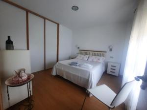 Postel nebo postele na pokoji v ubytování Casa da Xesteira-Merexo-Muxía-Costa da Morte