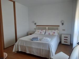 Postel nebo postele na pokoji v ubytování Casa da Xesteira-Merexo-Muxía-Costa da Morte