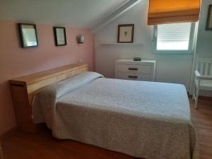 Postel nebo postele na pokoji v ubytování Casa da Xesteira-Merexo-Muxía-Costa da Morte