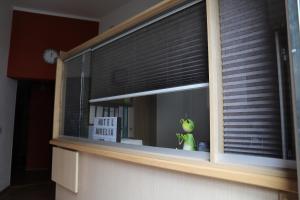a window with a green toy sitting on top of it at Hotel Aurelia in Frankfurt