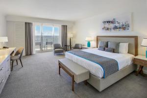 a hotel room with a large bed and a balcony at The Atlantic Hotel & Spa in Fort Lauderdale