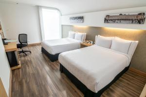 Un ou plusieurs lits dans un hébergement de l'établissement Sonesta Hotel Bogotá