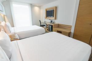 Un ou plusieurs lits dans un hébergement de l'établissement Sonesta Hotel Bogotá