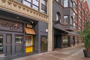 a row of shops on a city street at Prime 2BR Gem in River North Best Location!- Hubbard 2 in Chicago