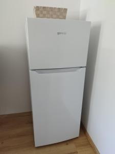 an empty white refrigerator in a room at Apartma MB center in Maribor