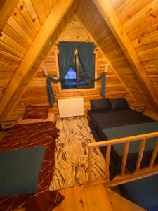an overhead view of a bedroom in a log cabin at Oksijen suit in Artvin