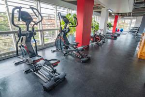 a gym with several exercise bikes in a room at Sonesta Hotel Bogotá in Bogotá