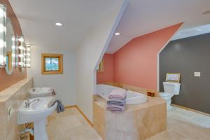a bathroom with a sink and a bath tub at Charming Stockholm Abode in Walkable Location! in Stockholm +18 photos