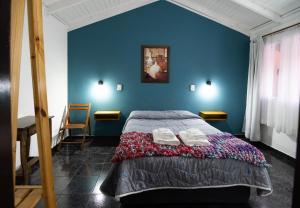 Postel nebo postele na pokoji v ubytování Hosteria Patagonia