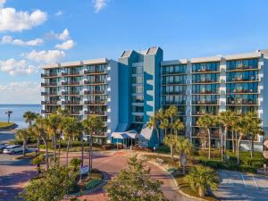 an image of a resort with the ocean in the background at Lovely Sandestin Resort Studio with Balcony and Sunset View in Destin