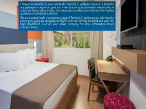 a poster of a hotel room with a bed and a desk at TRYP BY WYNDHAM São Paulo Airport - Hotel de Transito Terminal 3 INTERNACIONAL - Lado Ar - Área restrita á passageiros já embarcados e sem bagagens para despachar - Transit Hotel, only carry-on in Guarulhos