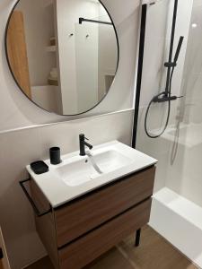 a bathroom with a sink and a mirror at Ca Tono Casa Rural in Les Coves de Vinroma