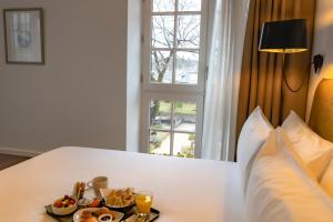Postel nebo postele na pokoji v ubytování Hôtel Ginkgo - SPA Biloba
