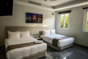 Voodi või voodid majutusasutuse Solmare Apartments & Suites toas