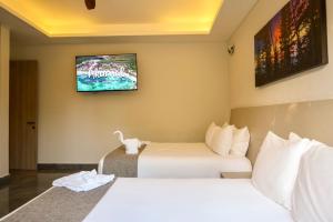 Voodi või voodid majutusasutuse Solmare Apartments & Suites toas