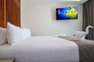 Voodi või voodid majutusasutuse Solmare Apartments & Suites toas