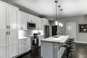 a kitchen with white cabinets and a white counter top at 145 Biltmore Ave Condo 541B0A in Asheville