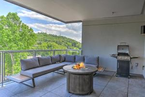 a living room with a couch and a table at Supreme Downtown Condo in Asheville
