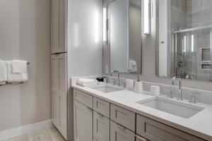 a bathroom with two sinks and a large mirror at 145 Biltmore Ave A New Luxury Condo 541E0D in Asheville +23 photos