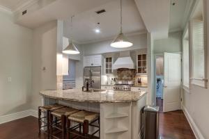 a kitchen with a large island with bar stools at 8 Village Lane 100 in Asheville