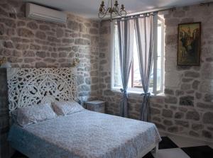 Ένα ή περισσότερα κρεβάτια σε δωμάτιο στο Apartments Jasmina