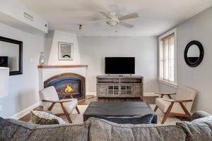 a living room with a couch and a fire place at 8 Village Lane 200 in Asheville