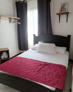 Postel nebo postele na pokoji v ubytování Villa 2 Coral Carrillo