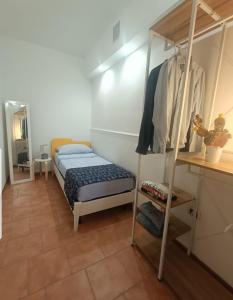 a bedroom with a bunk bed and a ladder at Appartamento Borgonuovo in Gallipoli