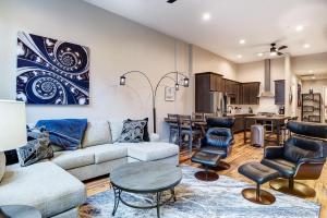 a living room with a couch and chairs and a kitchen at Large 3 bedroom 3 and a half Bath Downtown Condo in Asheville