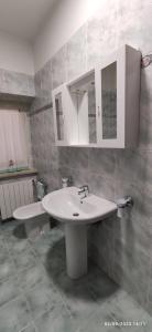 a bathroom with a white sink and a mirror at Alloggio tra Terni e Narni in Terni