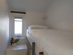 Ein Bett oder Betten in einem Zimmer der Unterkunft Waterpark Giethoorn