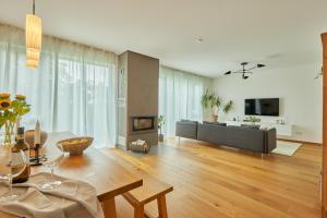 a living room with a table and a fireplace at Villa-Eggert in Bretten