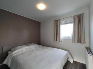 Ein Bett oder Betten in einem Zimmer der Unterkunft Waterpark Giethoorn