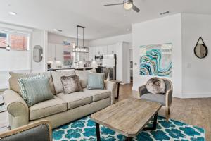 a living room with a couch and two chairs and a table at 55 South Market Condo 215 in Asheville
