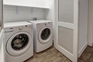 a laundry room with a washer and dryer at 55 South Market Condo 215 in Asheville