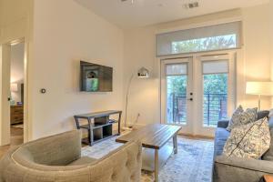 a living room with a couch and a table at 55 South Market Condo 204 in Asheville