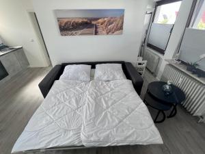 Кровать или кровати в номере Meerfreude Grömitz